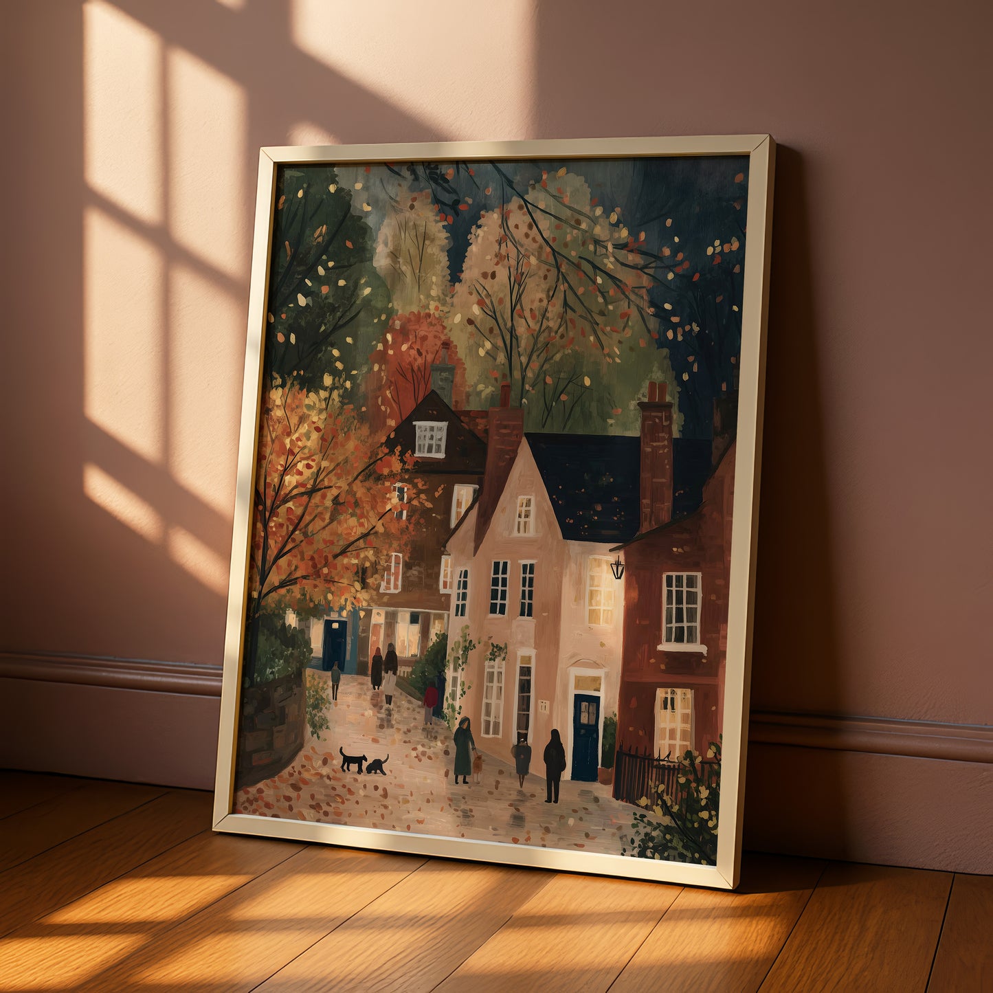 The image is a framed painting depicting a quaint village scene with colorful autumn foliage, brick houses, and people walking along the street.