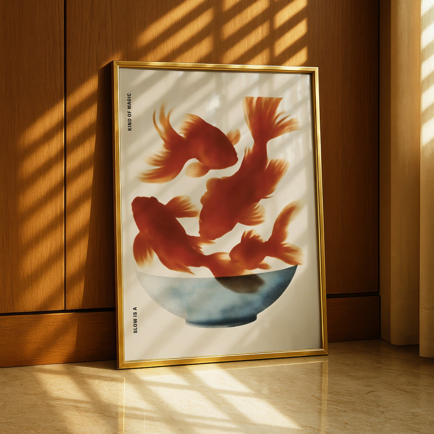 a framed artwork depicting three goldfish swimming in a bowl.