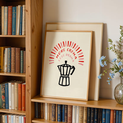 a bookshelf with a framed poster on it that says "MORE CREMA LESS DRAMA" in bold red and black text. The poster also includes a black silhouette of a coffee pot.