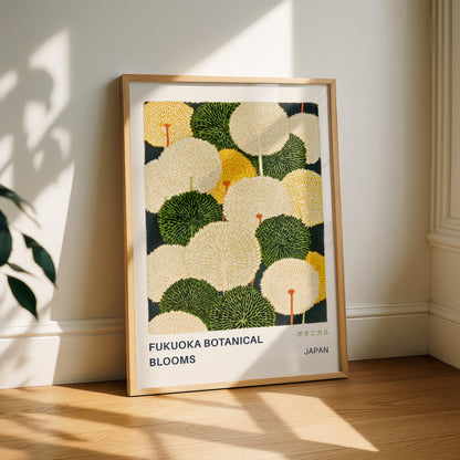 a framed poster of a botanical illustration of various flowers, including fukuoka blooms, displayed on a wooden floor against a white wall.