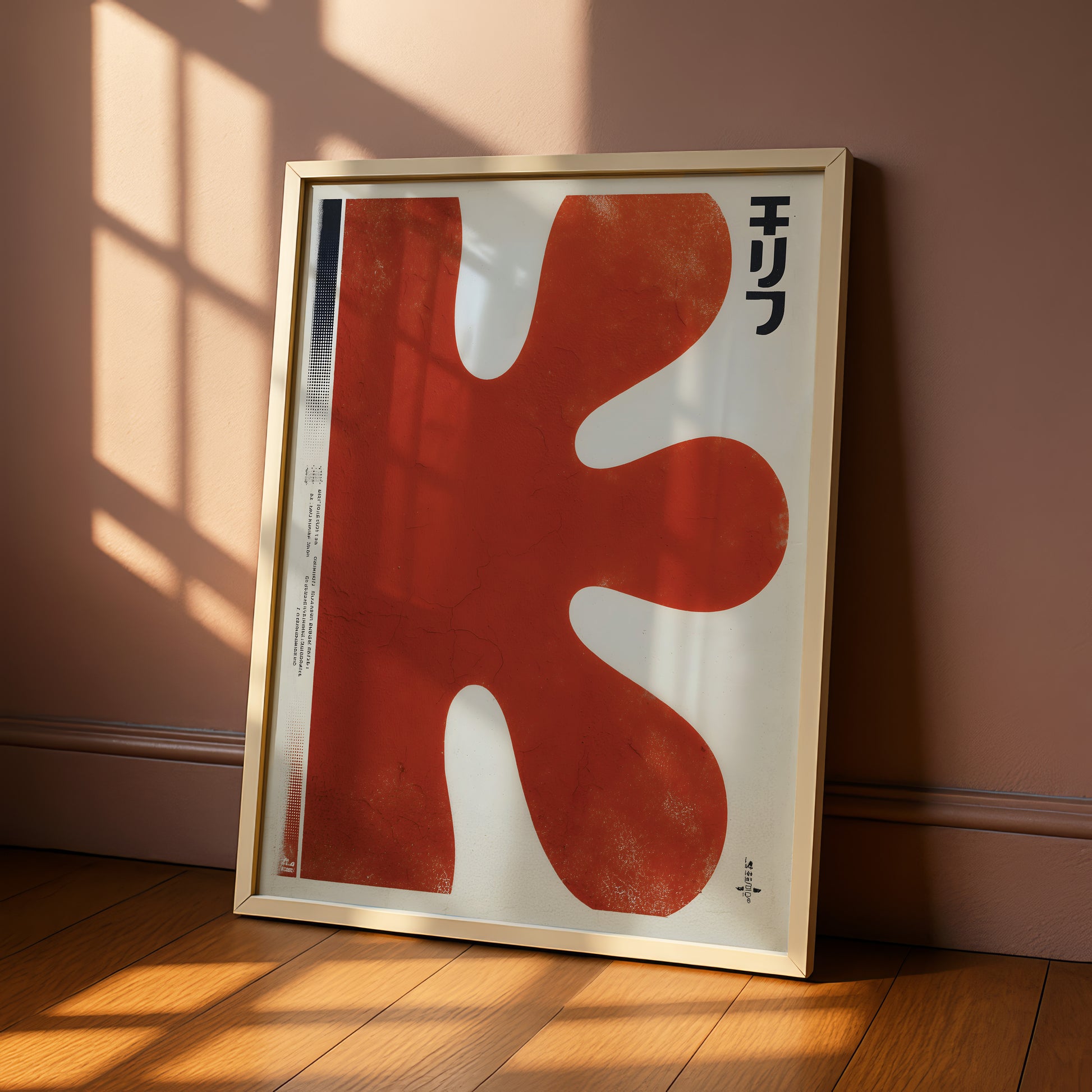 a large, abstract red shape with a white border, standing on a wooden floor against a pink wall.