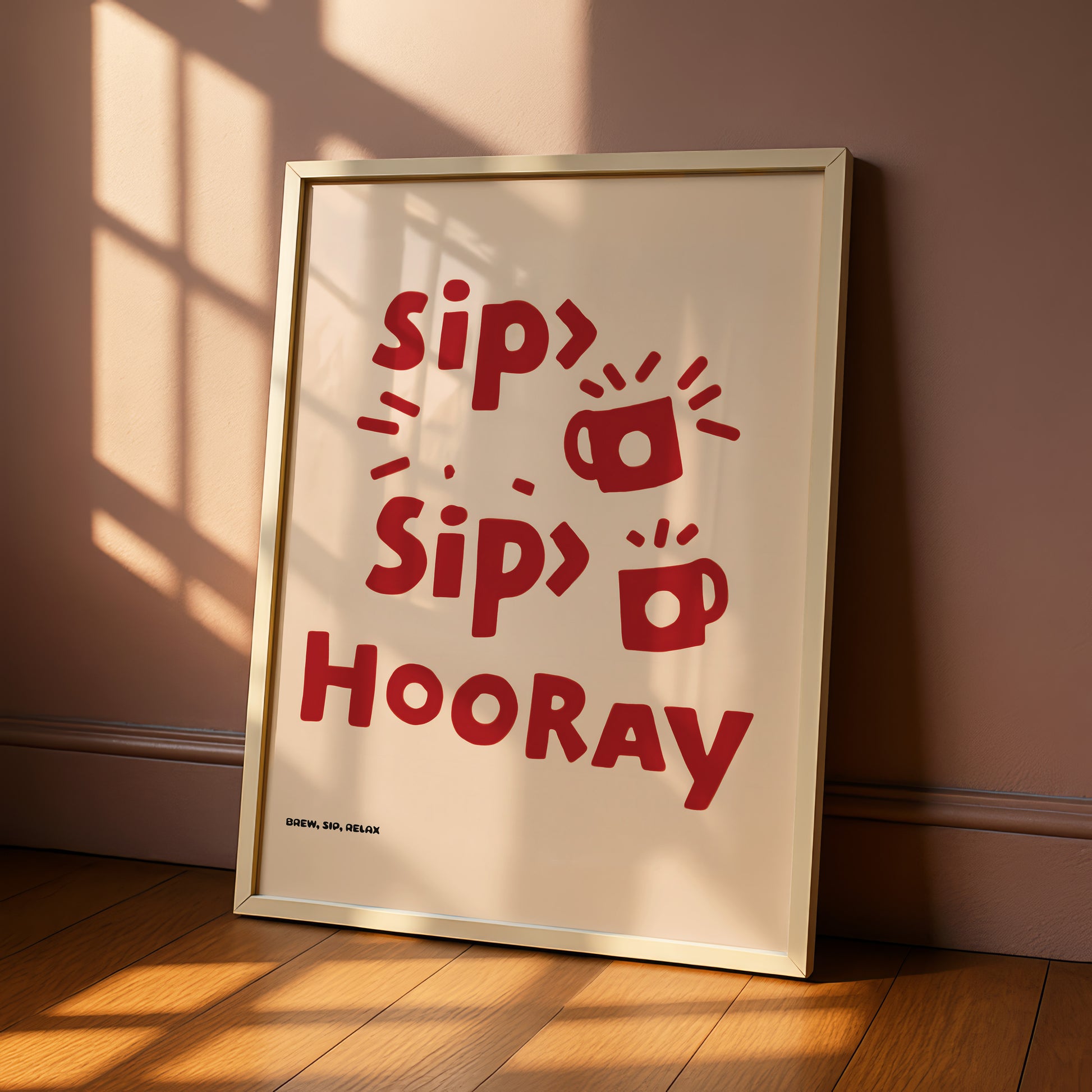 A framed poster with the text "Sip Sip Hooray" in red letters, along with some stylized illustrations of cups and saucers.