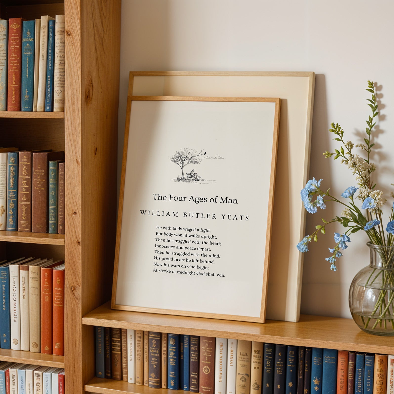 A framed print titled "The Four Ages of Man" by William Butler Yeats, placed on a bookshelf next to a vase of blue flowers.