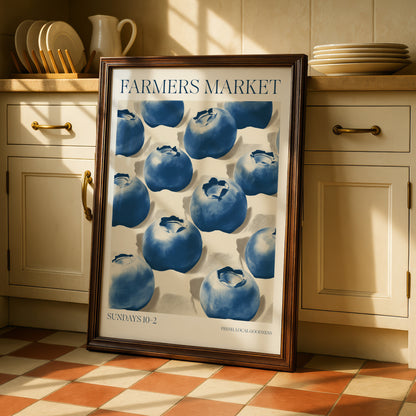a framed poster of blueberries on a kitchen counter, with a sign that reads "Farmers Market" and "SUNPADS 10-2" below it.