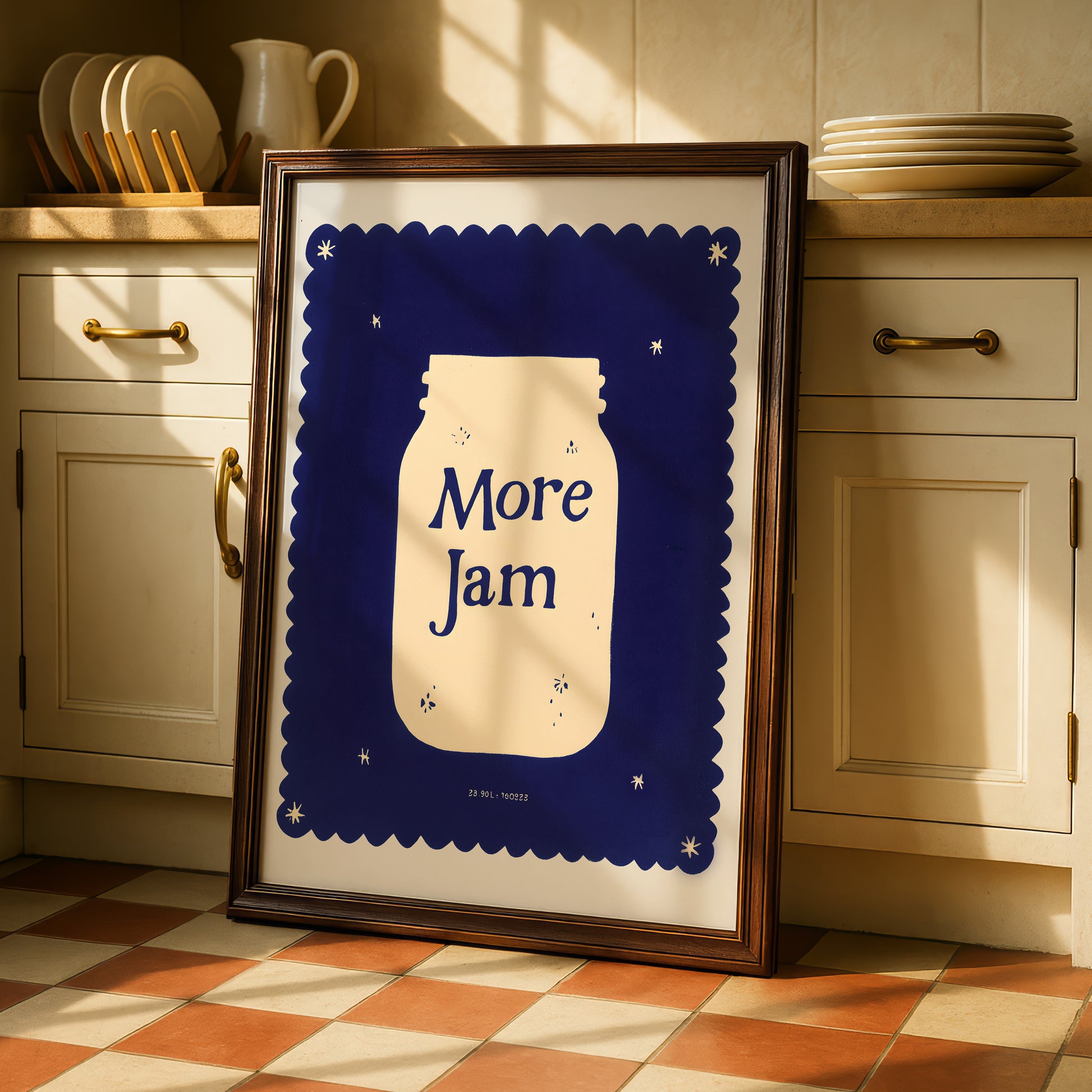 A framed poster with a blue background and a white jar illustration, displaying the text "More Jam" in a playful font.
