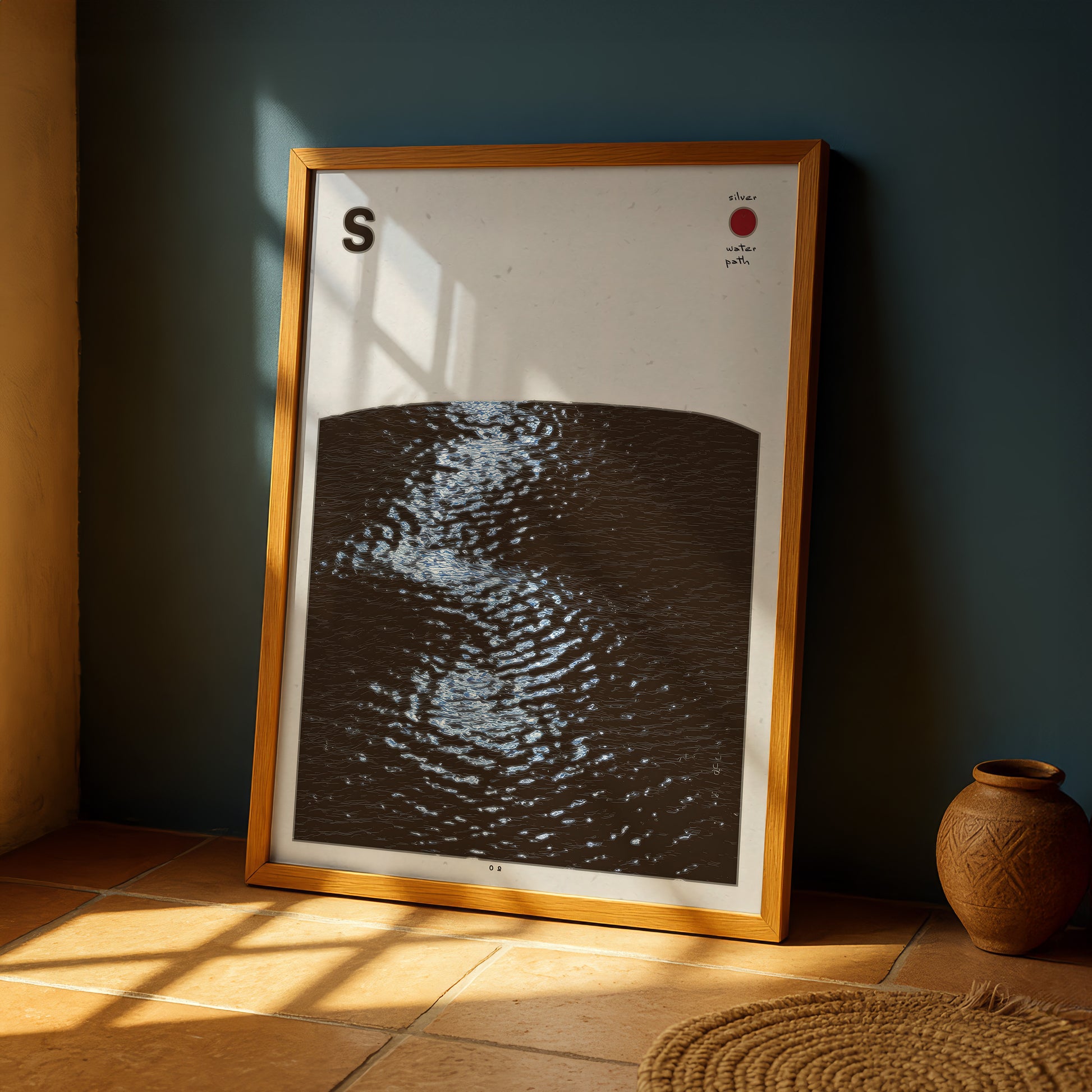 a framed artwork depicting a black and white abstract representation of water, with a red dot in the top right corner.