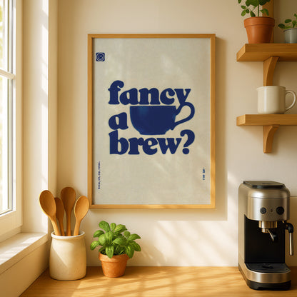 a framed poster with the text " Fancy a brew?" hanging on a wall above a coffee maker and a potted plant.