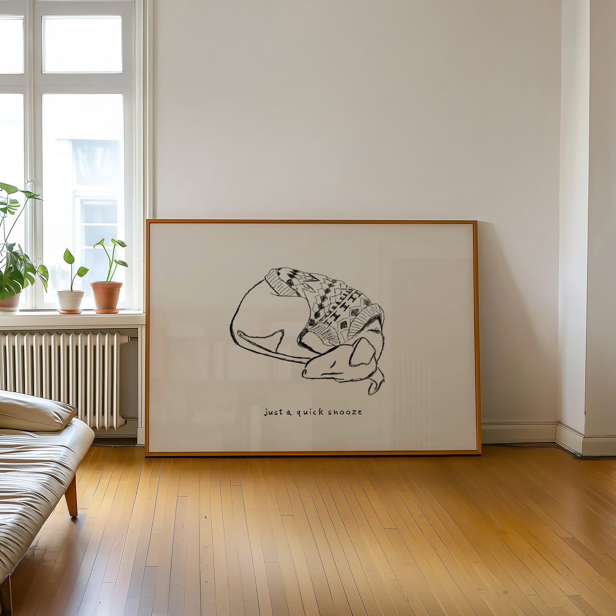 Sleeping Whippet in Sweater Print framed on a wall