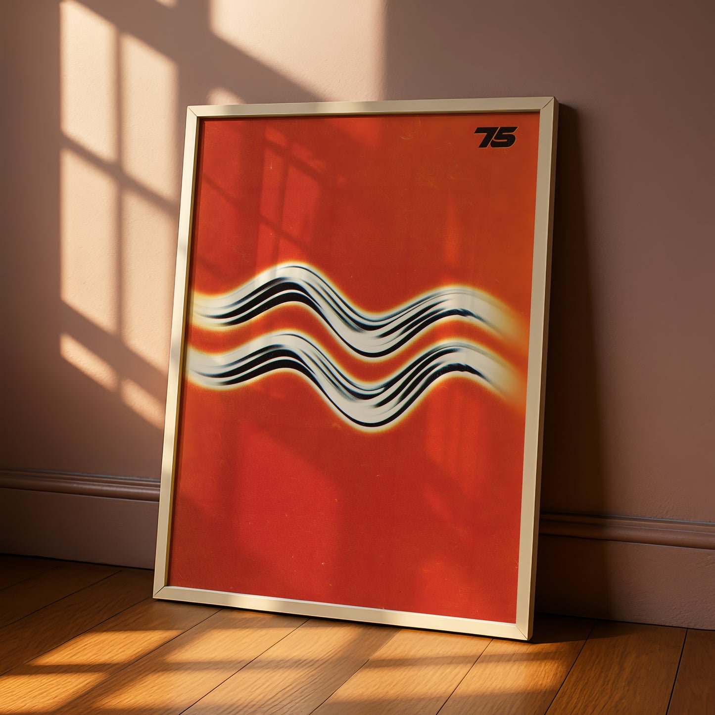 a vibrant red poster with a striking black and white wave design, leaning against a wall on a wooden floor.