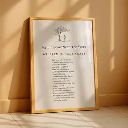 a framed poem titled "Men Improve With The Years" by William Butler Yeats, which is displayed on a wooden surface.
