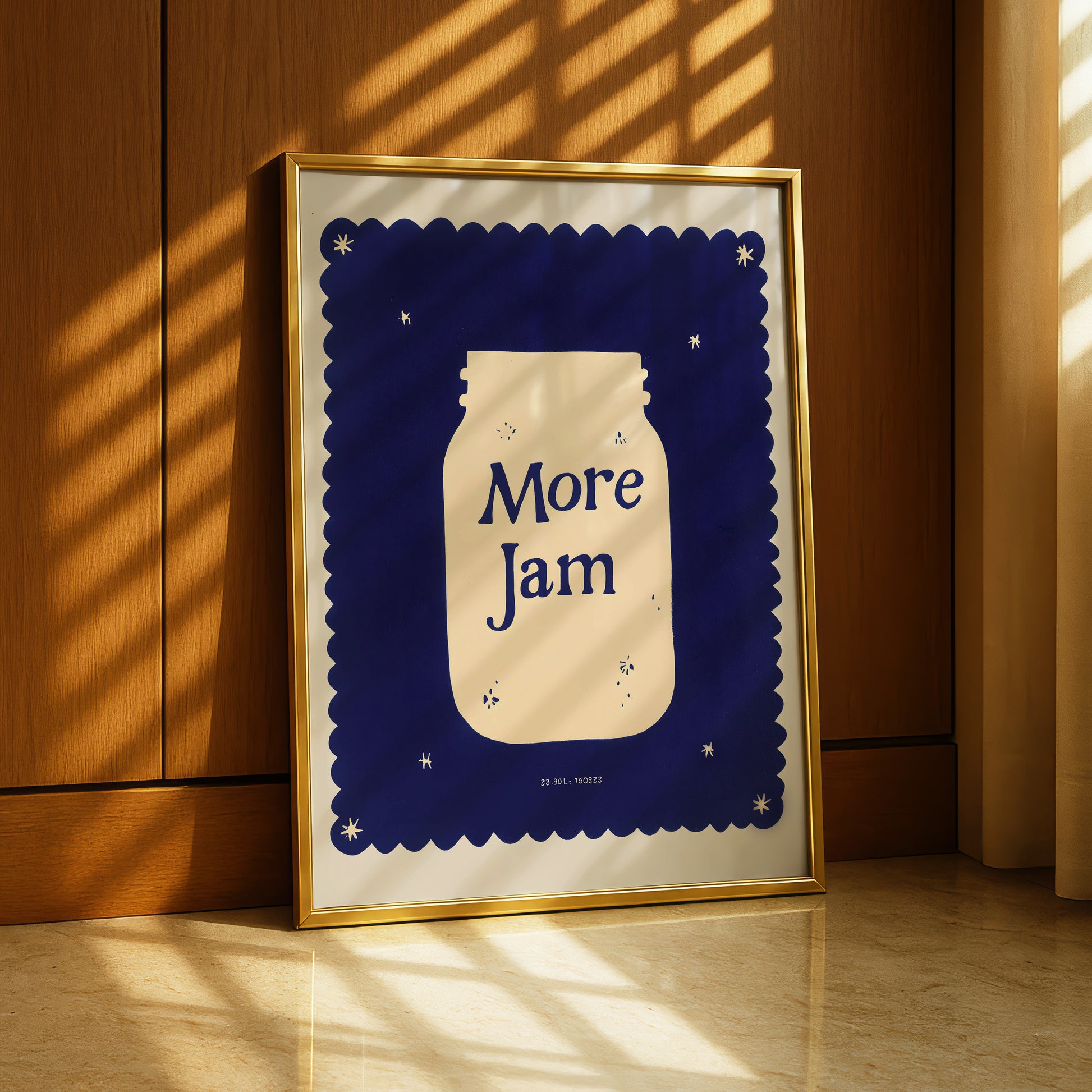 A framed poster with a blue background and a white jar illustration, displaying the text "More Jam" in bold letters.