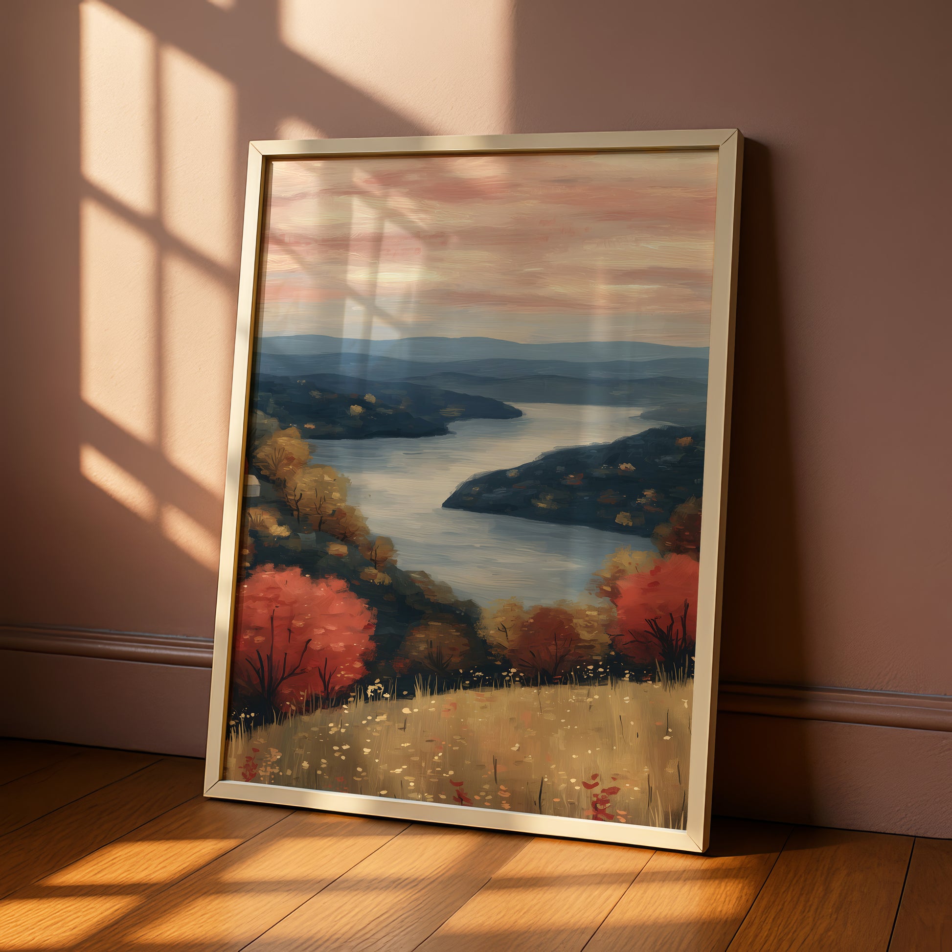 a framed painting of a serene landscape with a river, mountains, and trees in autumn colors.