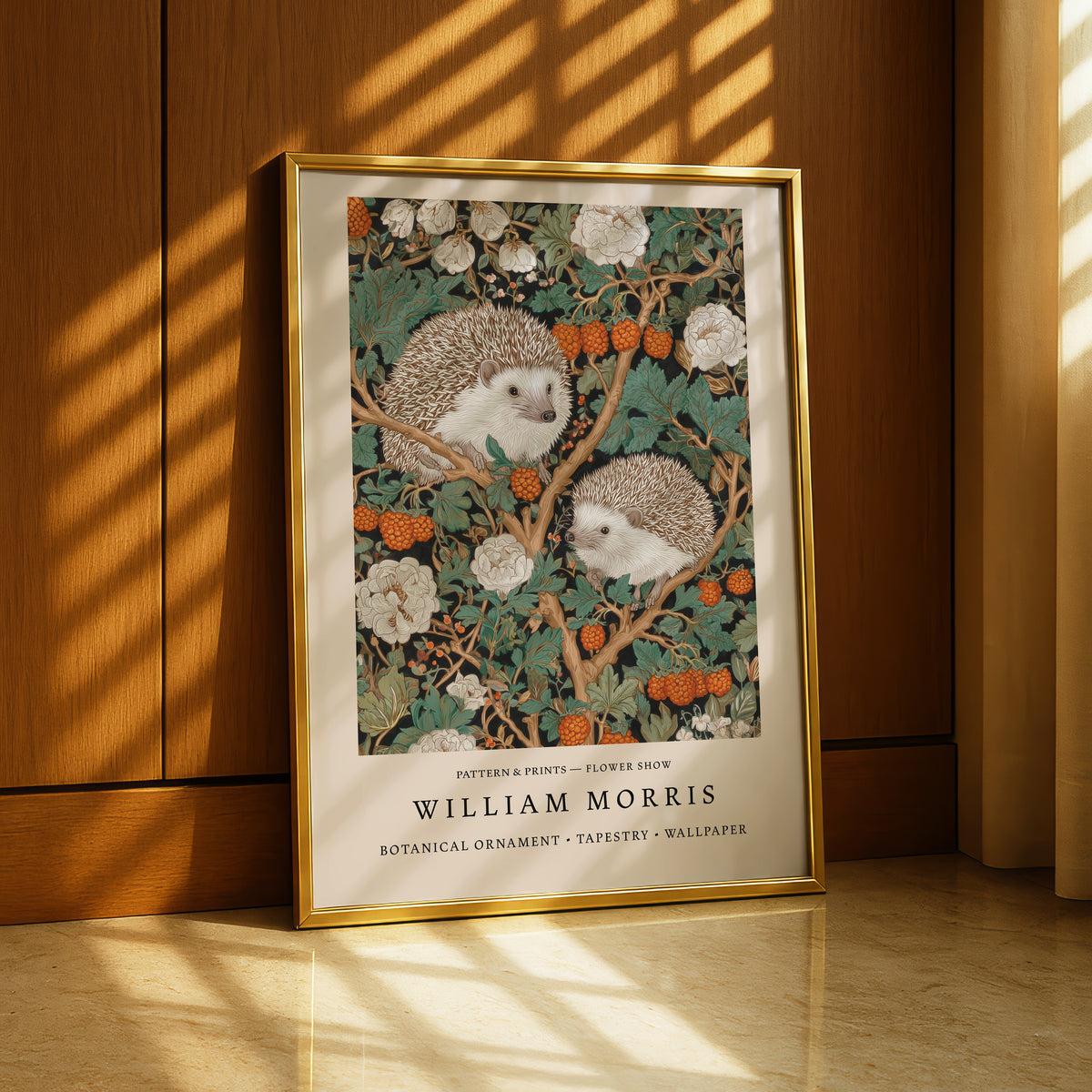 A framed painting of two hedgehogs sitting on a branch with flowers and berries.
